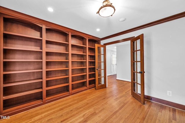 1820 Hunting Ridge Rd, Raleigh, NC 27615 - unfurnished room with french doors, light wood-type flooring, crown molding, and recessed lighting