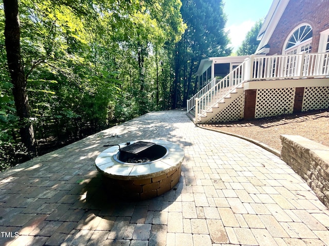 21 Covington Ln, Durham, NC 27712 - view of patio / terrace with stairway, an outdoor fire pit, and a deck