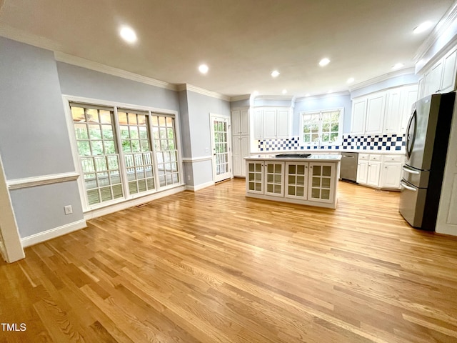 21 Covington Ln, Durham, NC 27712 - unfurnished living room featuring light wood-style flooring, crown molding, and recessed lighting