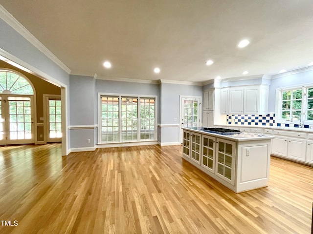 21 Covington Ln, Durham, NC 27712 - kitchen with light wood-style floors, white cabinets, light countertops, decorative backsplash, and recessed lighting