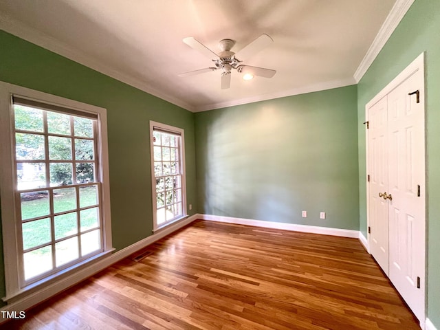 21 Covington Ln, Durham, NC 27712 - empty room featuring wood finished floors, crown molding, and a ceiling fan