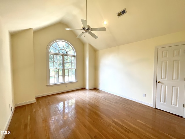 21 Covington Ln, Durham, NC 27712 - spare room with wood finished floors, ceiling fan, and vaulted ceiling
