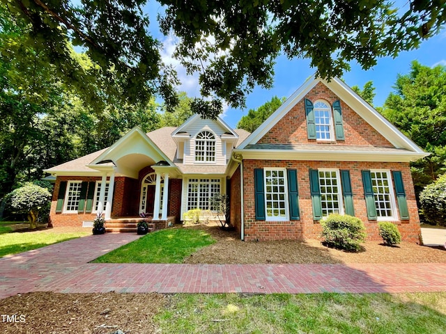 21 Covington Ln, Durham, NC 27712 - view of front of house featuring brick siding and a front yard