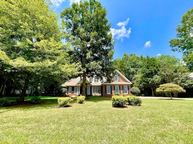 21 Covington Ln, Durham, NC 27712 - view of front of property with a front yard and brick siding