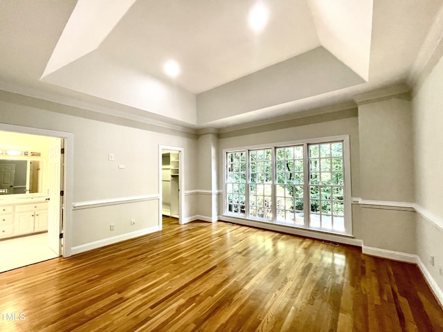 21 Covington Ln, Durham, NC 27712 - spare room featuring wood finished floors, a raised ceiling, and crown molding