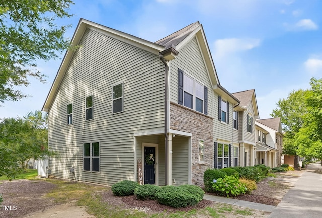 4520 Middletown Dr, Wake Forest, NC 27587 - view of side of home featuring stone siding and a residential view