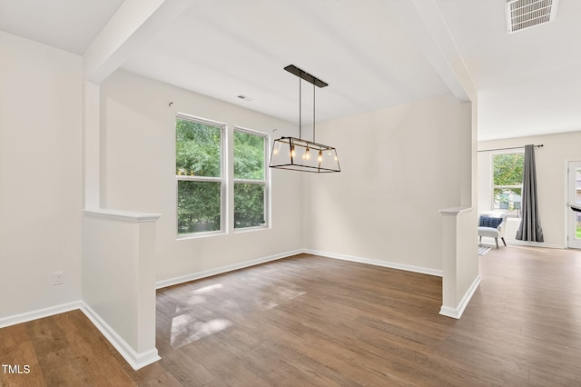4520 Middletown Dr, Wake Forest, NC 27587 - unfurnished dining area featuring wood finished floors and a chandelier
