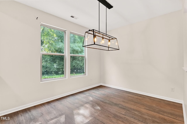 4520 Middletown Dr, Wake Forest, NC 27587 - unfurnished dining area with dark wood-style floors and a chandelier