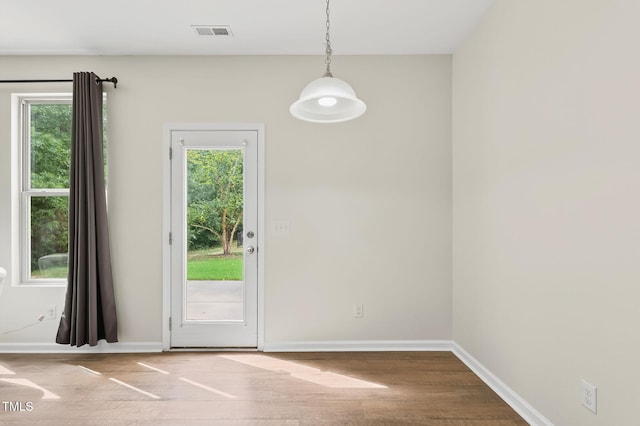 4520 Middletown Dr, Wake Forest, NC 27587 - unfurnished dining area featuring plenty of natural light and wood finished floors