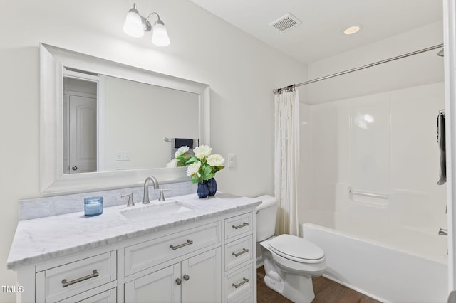 4520 Middletown Dr, Wake Forest, NC 27587 - bathroom featuring vanity, shower / bathtub combination with curtain, and wood finished floors