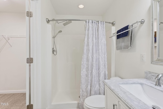 4520 Middletown Dr, Wake Forest, NC 27587 - bathroom with vanity, a shower with curtain, and a spacious closet