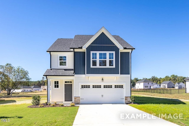 399 Old Fashioned Way, Lillington, NC 27546 - craftsman-style home featuring concrete driveway, a garage, stone siding, roof with shingles, and board and batten siding