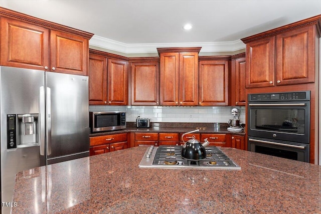 7804 Percussion Dr, Apex, NC 27539 - kitchen with stainless steel appliances, backsplash, ornamental molding, dark stone countertops, and brown cabinetry