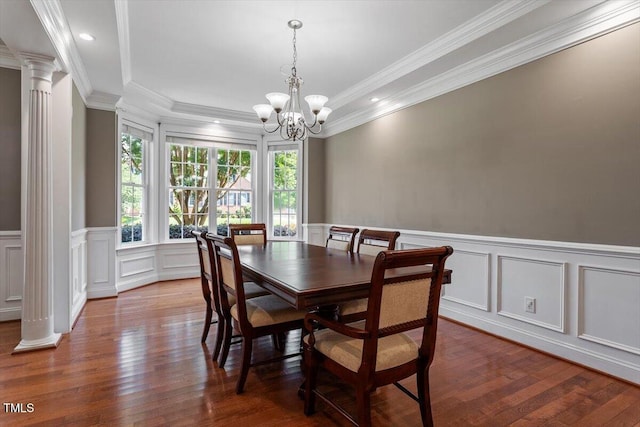 7804 Percussion Dr, Apex, NC 27539 - dining space featuring a chandelier, ornate columns, wood finished floors, a decorative wall, and a wainscoted wall