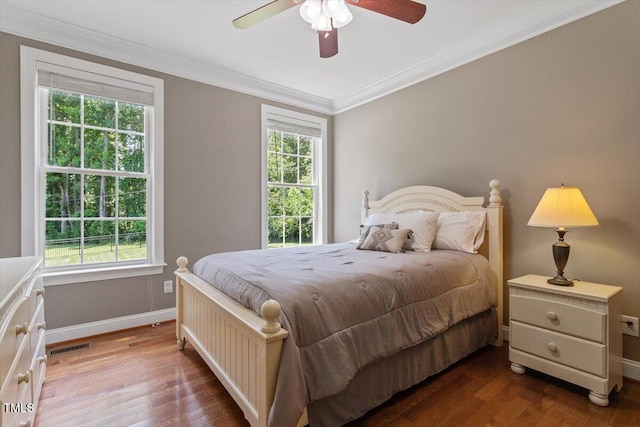 7804 Percussion Dr, Apex, NC 27539 - bedroom featuring wood finished floors, ornamental molding, and ceiling fan