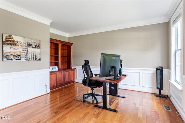 7804 Percussion Dr, Apex, NC 27539 - home office featuring light wood-type flooring, crown molding, a decorative wall, and a wainscoted wall