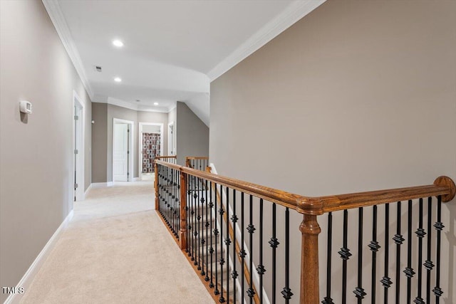 7804 Percussion Dr, Apex, NC 27539 - hallway with an upstairs landing, light carpet, recessed lighting, and ornamental molding