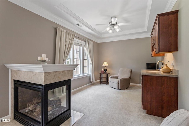 7804 Percussion Dr, Apex, NC 27539 - living area with a tray ceiling, a ceiling fan, ornamental molding, light carpet, and a multi sided fireplace