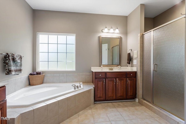 7804 Percussion Dr, Apex, NC 27539 - bathroom with vanity, a garden tub, a shower stall, and tile patterned flooring