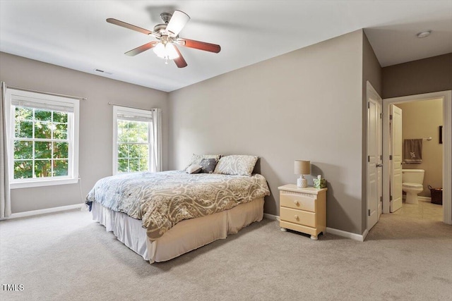 7804 Percussion Dr, Apex, NC 27539 - bedroom with light carpet, a ceiling fan, and connected bathroom