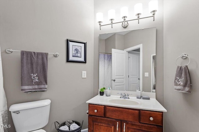 7804 Percussion Dr, Apex, NC 27539 - bathroom featuring vanity and toilet