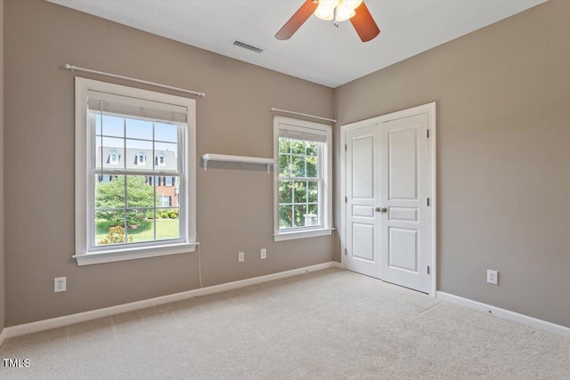 7804 Percussion Dr, Apex, NC 27539 - unfurnished bedroom featuring carpet, a closet, and ceiling fan
