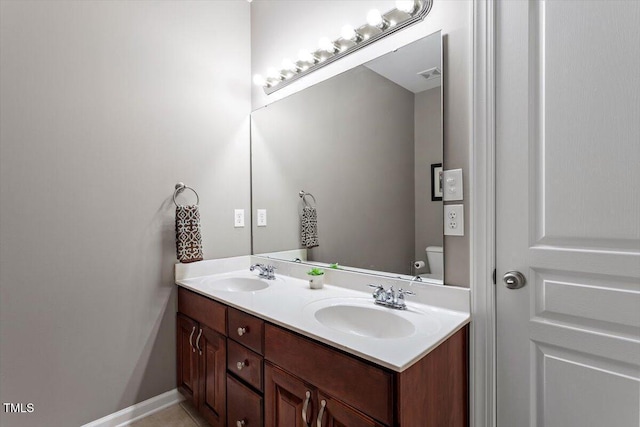 7804 Percussion Dr, Apex, NC 27539 - bathroom featuring double vanity and toilet