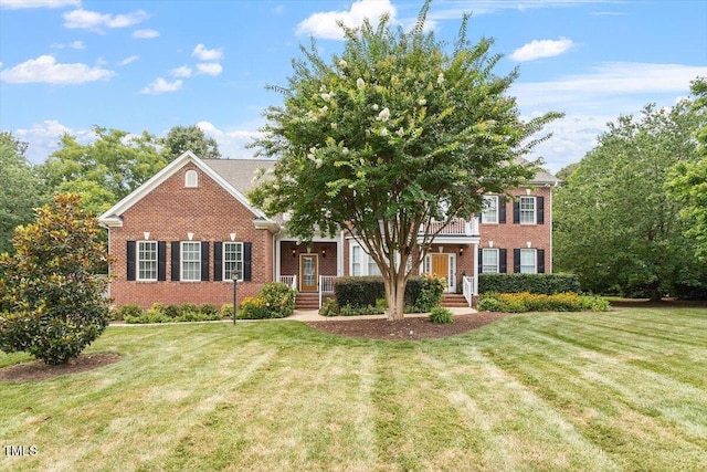 7804 Percussion Dr, Apex, NC 27539 - view of front of property with brick siding and a front lawn