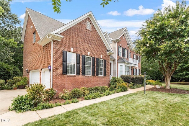 7804 Percussion Dr, Apex, NC 27539 - view of side of home with brick siding, a lawn, concrete driveway, an attached garage, and a shingled roof