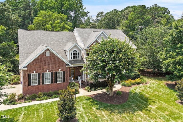 7804 Percussion Dr, Apex, NC 27539 - view of front of property with brick siding, a front lawn, and roof with shingles