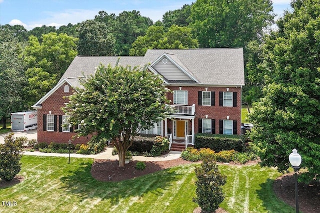 7804 Percussion Dr, Apex, NC 27539 - view of front facade featuring brick siding and a front yard