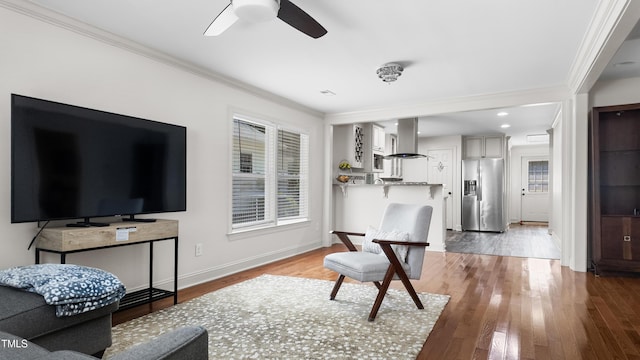 304 Spring St, Durham, NC 27703 - living area with ornamental molding, ceiling fan, and wood finished floors