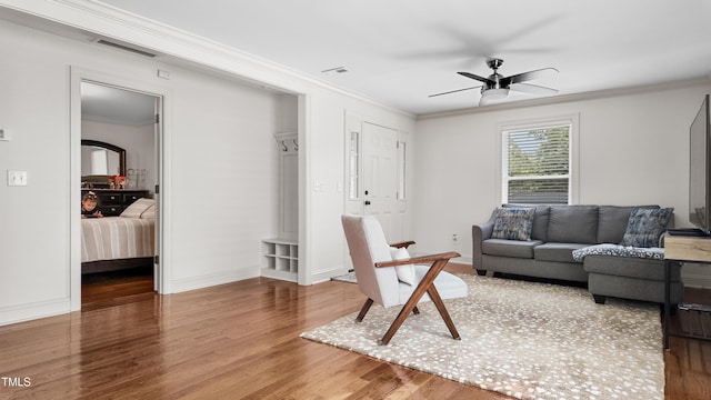 304 Spring St, Durham, NC 27703 - living area featuring wood finished floors, ceiling fan, and crown molding