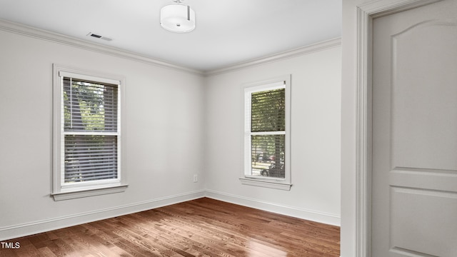 304 Spring St, Durham, NC 27703 - empty room with ornamental molding and wood finished floors