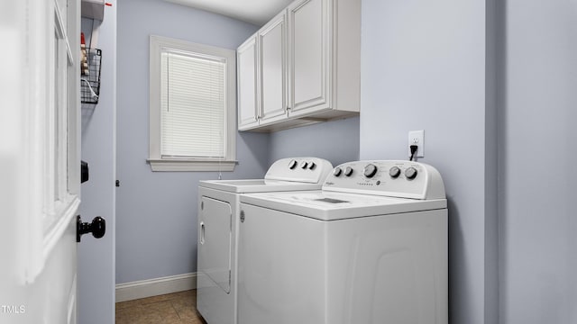 304 Spring St, Durham, NC 27703 - washroom featuring independent washer and dryer, cabinet space, and light tile patterned flooring