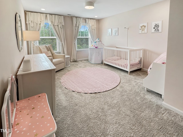 2438 Braxton Wood Ln, Apex, NC 27523 - bedroom with carpet floors, a crib, and recessed lighting