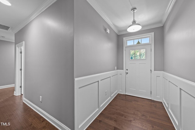 4125 Olde Judd Dr, Willow Springs, NC 27592 - doorway to outside featuring crown molding, wainscoting, dark wood-style floors, and a decorative wall
