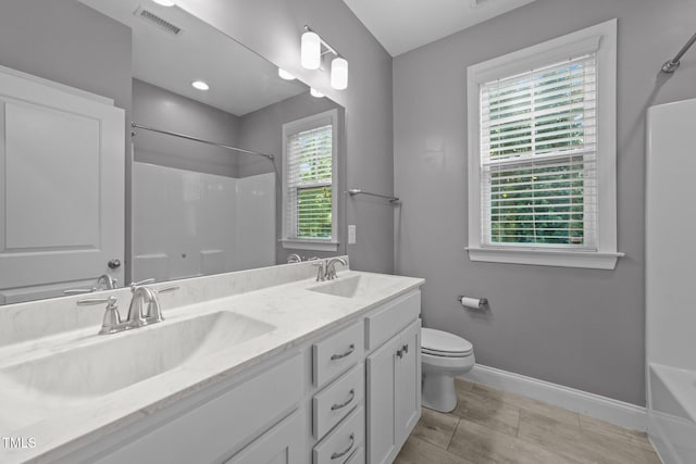 4125 Olde Judd Dr, Willow Springs, NC 27592 - full bathroom with double vanity and toilet