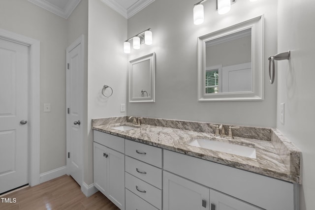 4125 Olde Judd Dr, Willow Springs, NC 27592 - bathroom with wood finished floors, double vanity, and ornamental molding