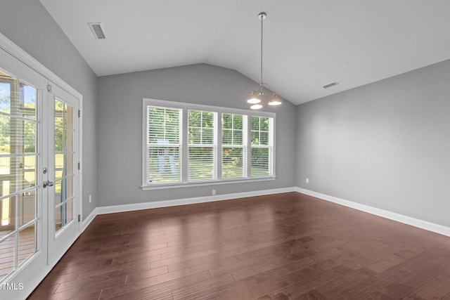 4125 Olde Judd Dr, Willow Springs, NC 27592 - unfurnished dining area featuring vaulted ceiling, dark wood-type flooring, french doors, and a chandelier