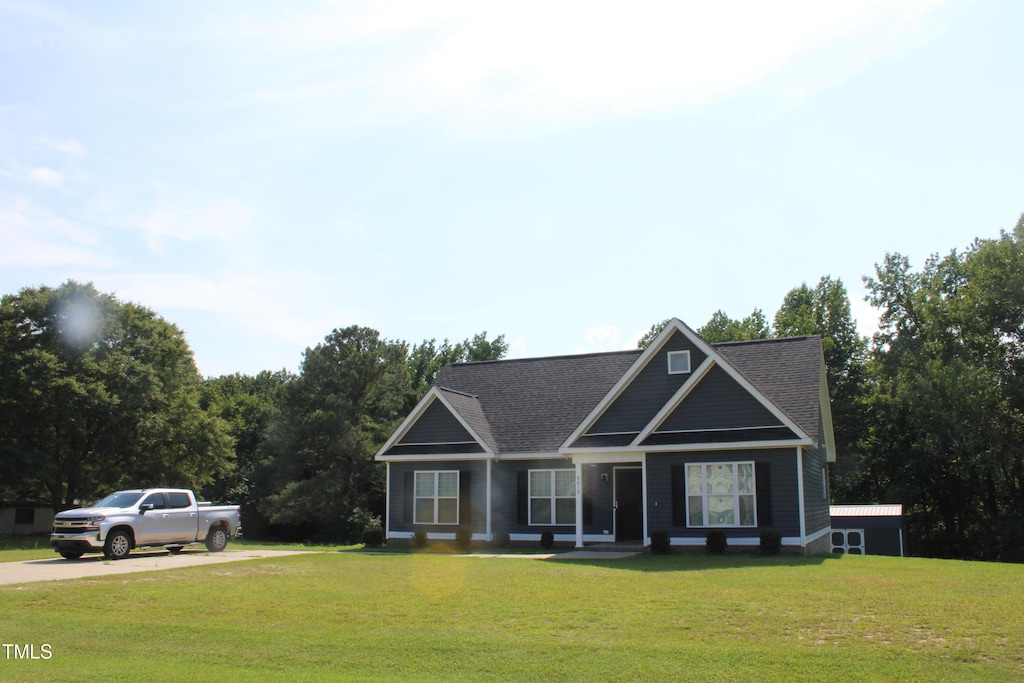 6619 Gabriels Way, Lucama, NC 27851 - craftsman inspired home featuring a front lawn, driveway, and roof with shingles