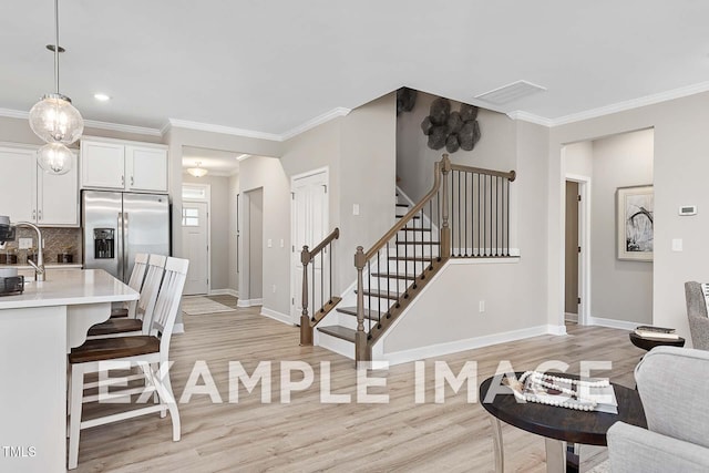 173 Old Fashioned Way, Lillington, NC 27546 - living room with light wood finished floors, crown molding, stairs, and recessed lighting