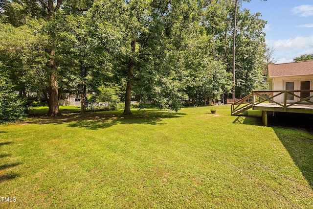 1010 Oakgrove Dr, Knightdale, NC 27545 - view of green lawn with a deck