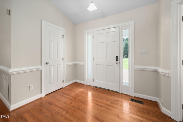 1010 Oakgrove Dr, Knightdale, NC 27545 - foyer entrance with wood finished floors and vaulted ceiling