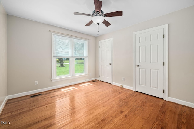 1010 Oakgrove Dr, Knightdale, NC 27545 - unfurnished bedroom with light wood-style floors, a ceiling fan, and a closet