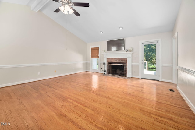 1010 Oakgrove Dr, Knightdale, NC 27545 - unfurnished living room featuring ceiling fan, light wood-type flooring, and a brick fireplace