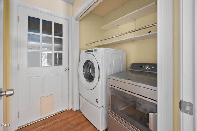 1010 Oakgrove Dr, Knightdale, NC 27545 - laundry room featuring washer and dryer and wood finished floors