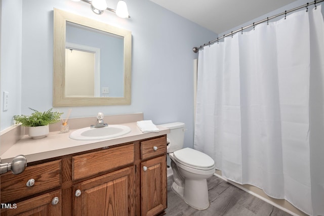 1010 Oakgrove Dr, Knightdale, NC 27545 - full bathroom with vanity, wood finished floors, and a shower with shower curtain