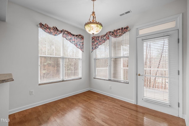 232 Eyam Hall Ln, Apex, NC 27502 - unfurnished dining area featuring wood finished floors and baseboards
