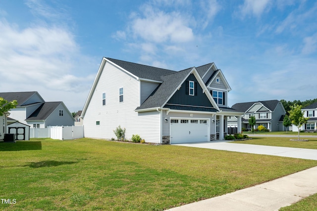 3206 Dandelion Dr, Grimesland, NC 27837 - view of front of home with concrete driveway, board and batten siding, stone siding, roof with shingles, and a shed